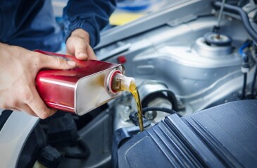mechanic-changing-engine-oil-on-car-vehicle-min